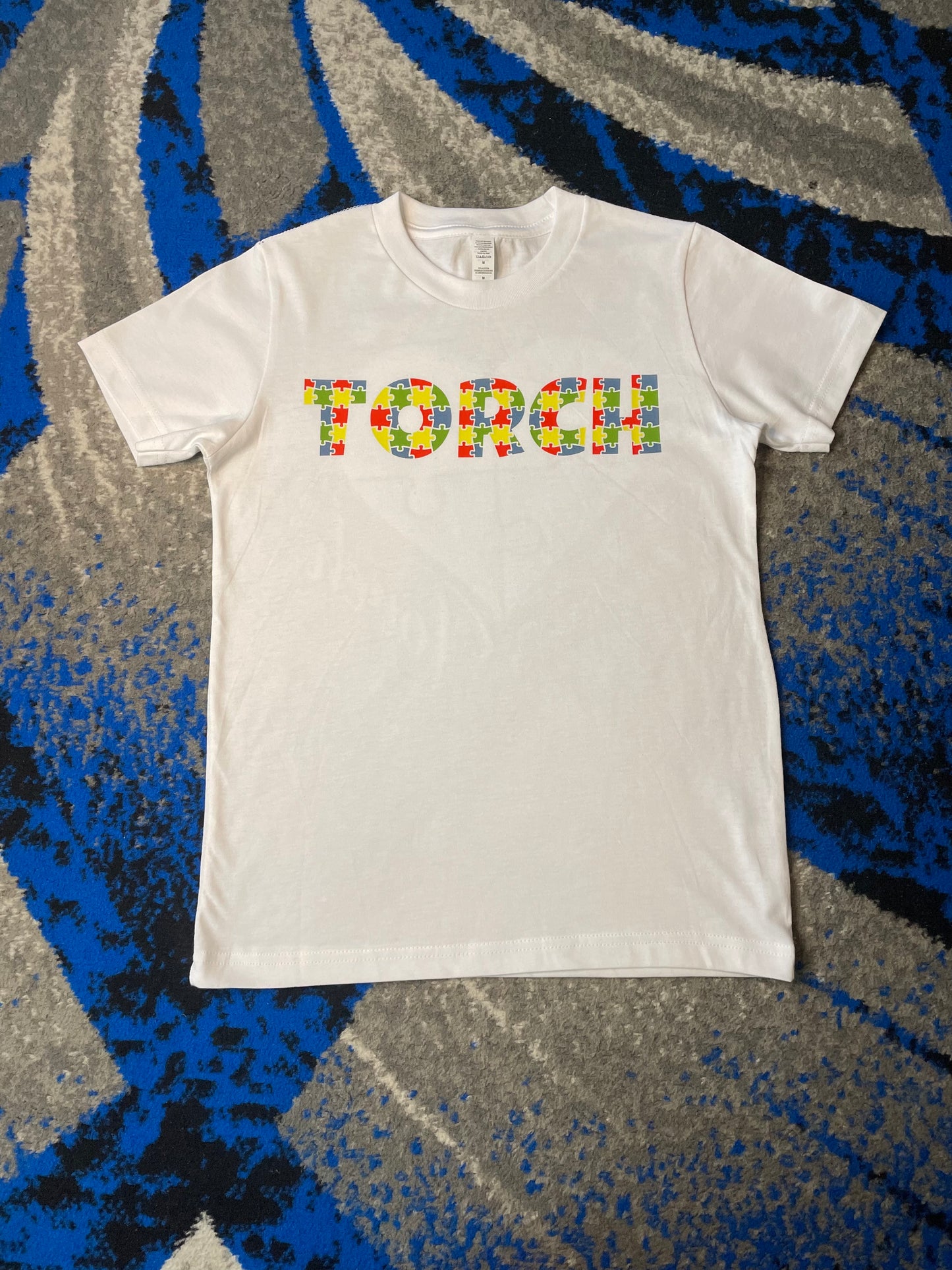 Torch puzzle tee